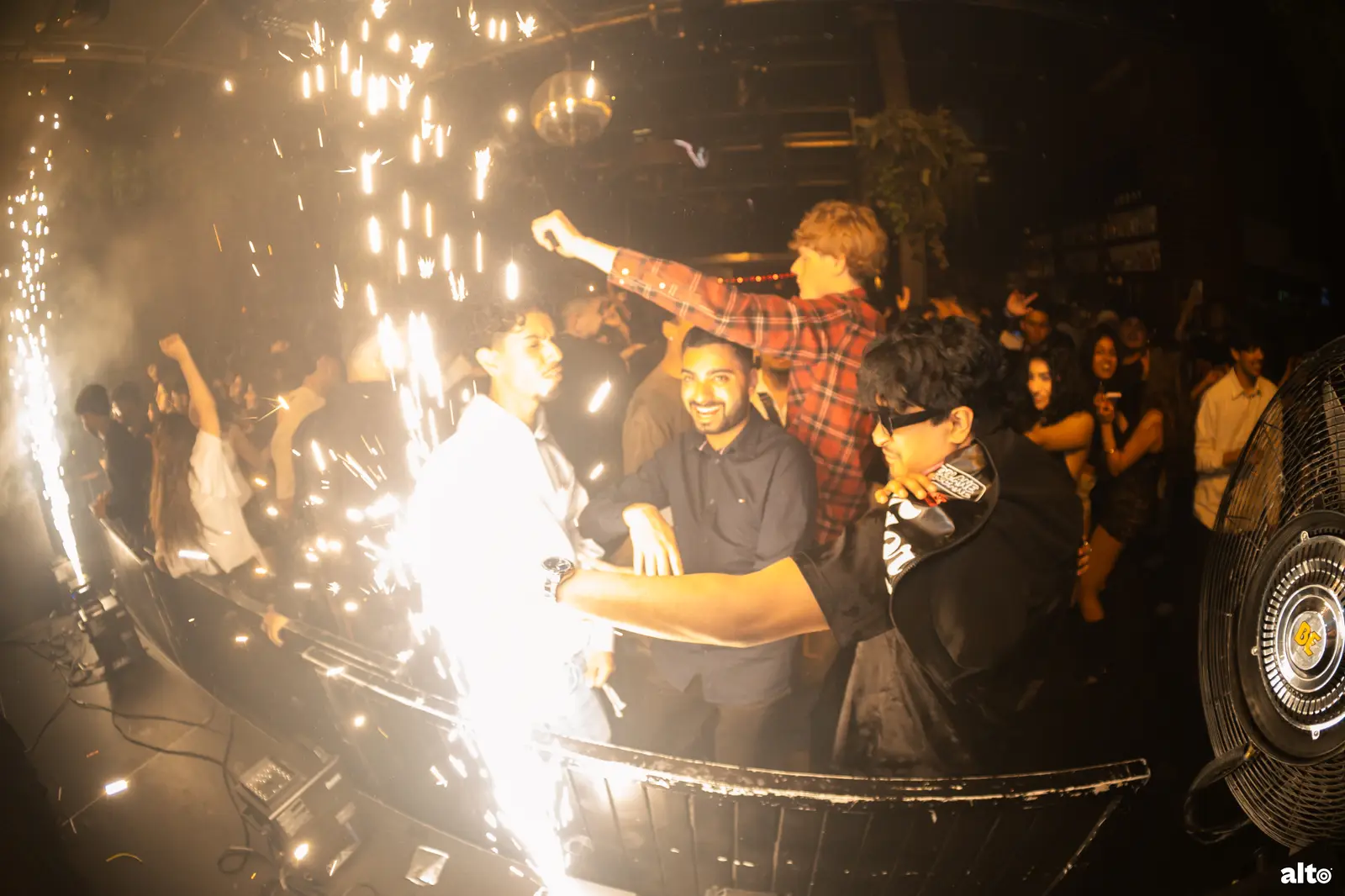 DJ set with sparklers at a MUIC night
