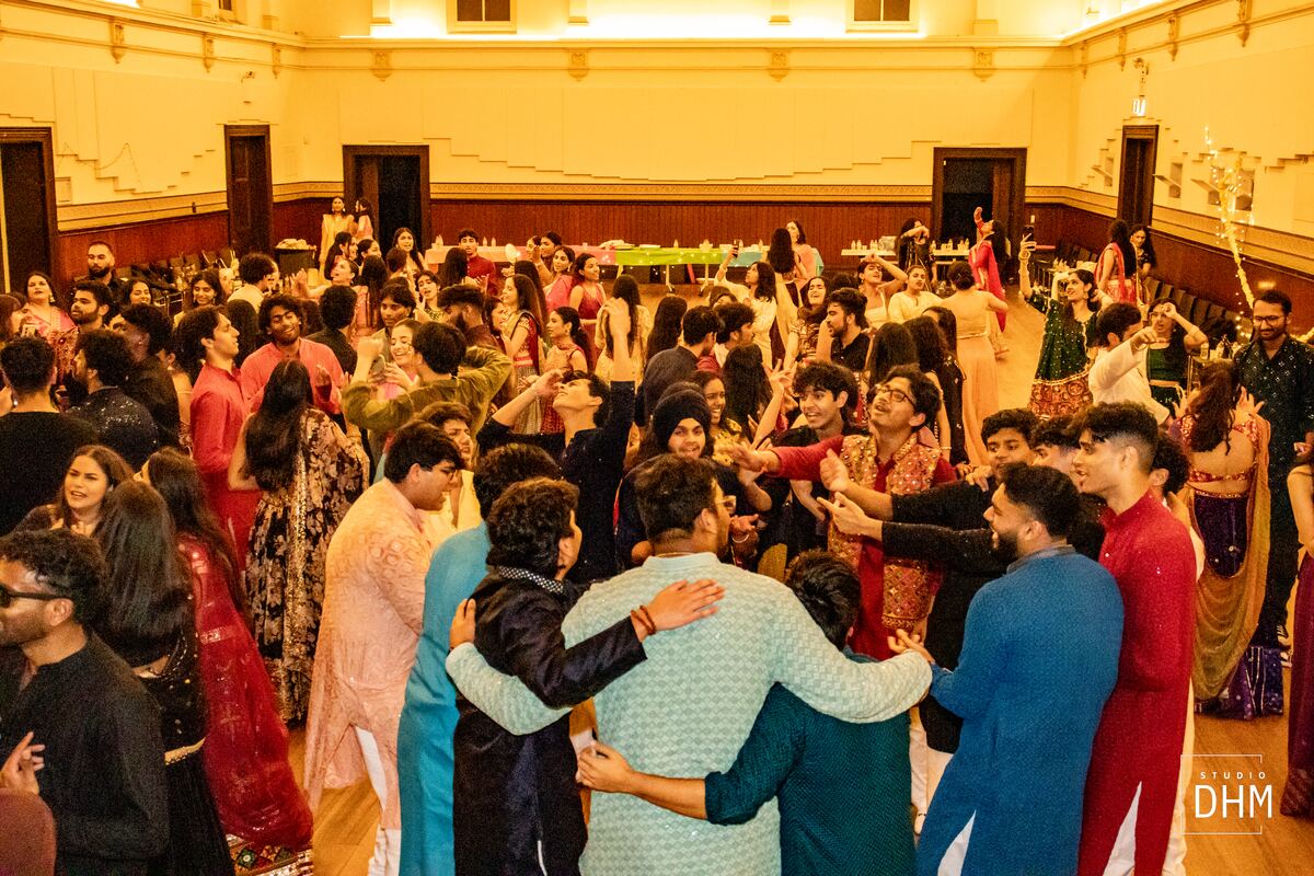 Students laughing together in the Garba circle