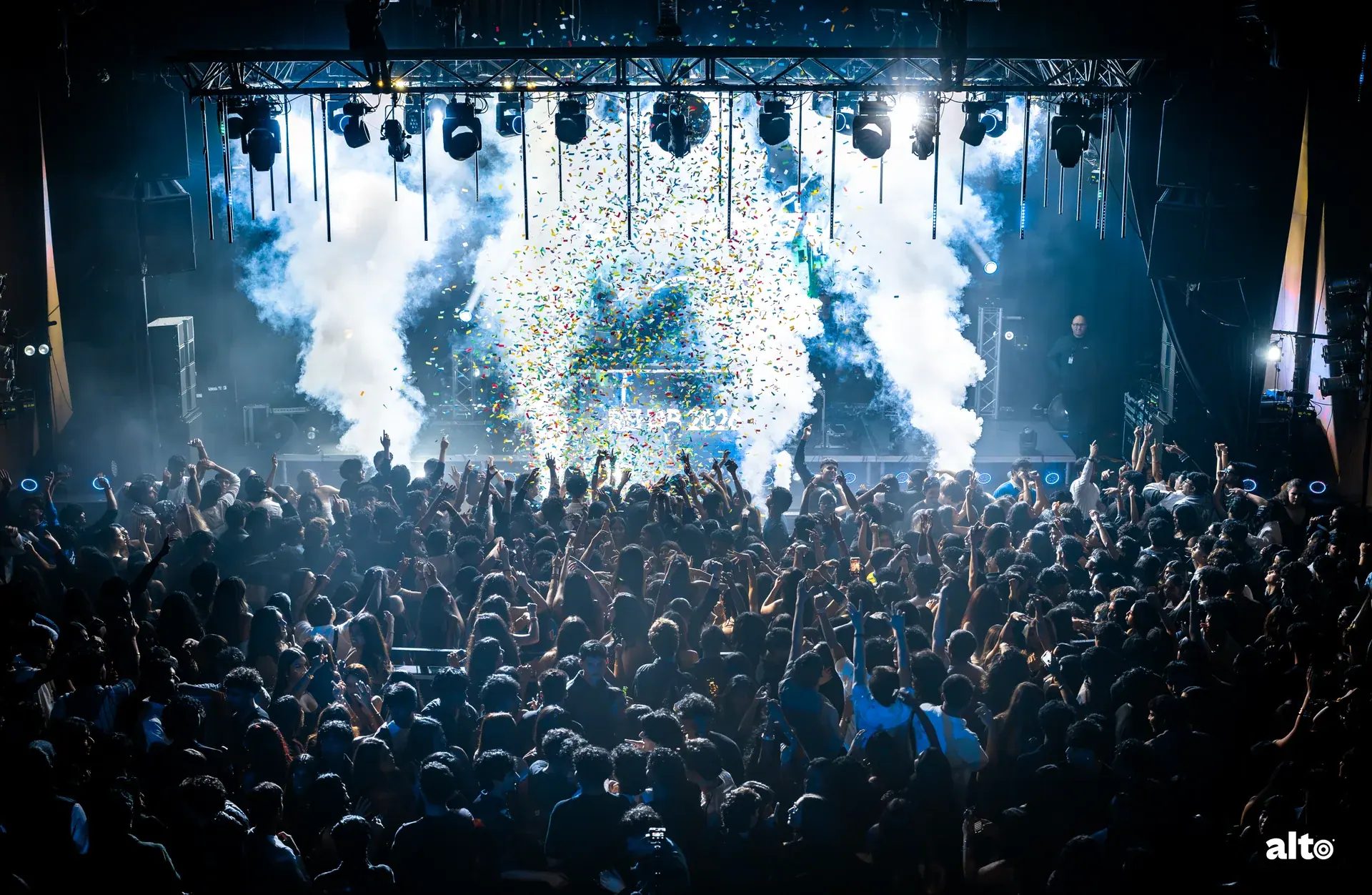 Confetti and raised hands filling the room at Rehab