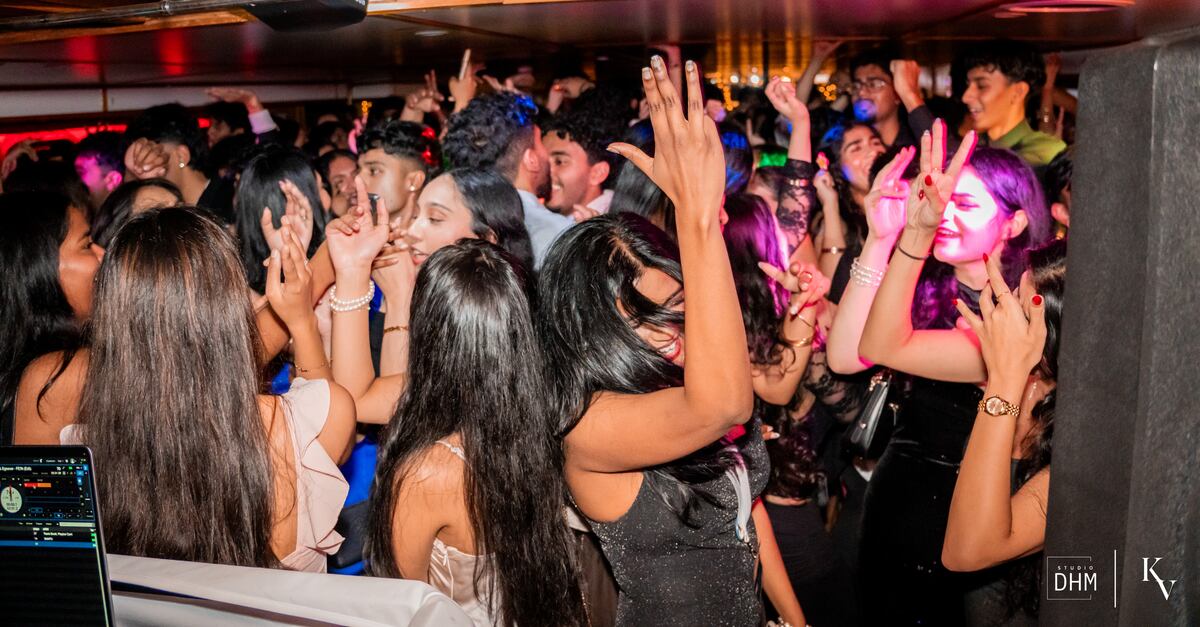 The top deck of a MUIC boat party at golden hour