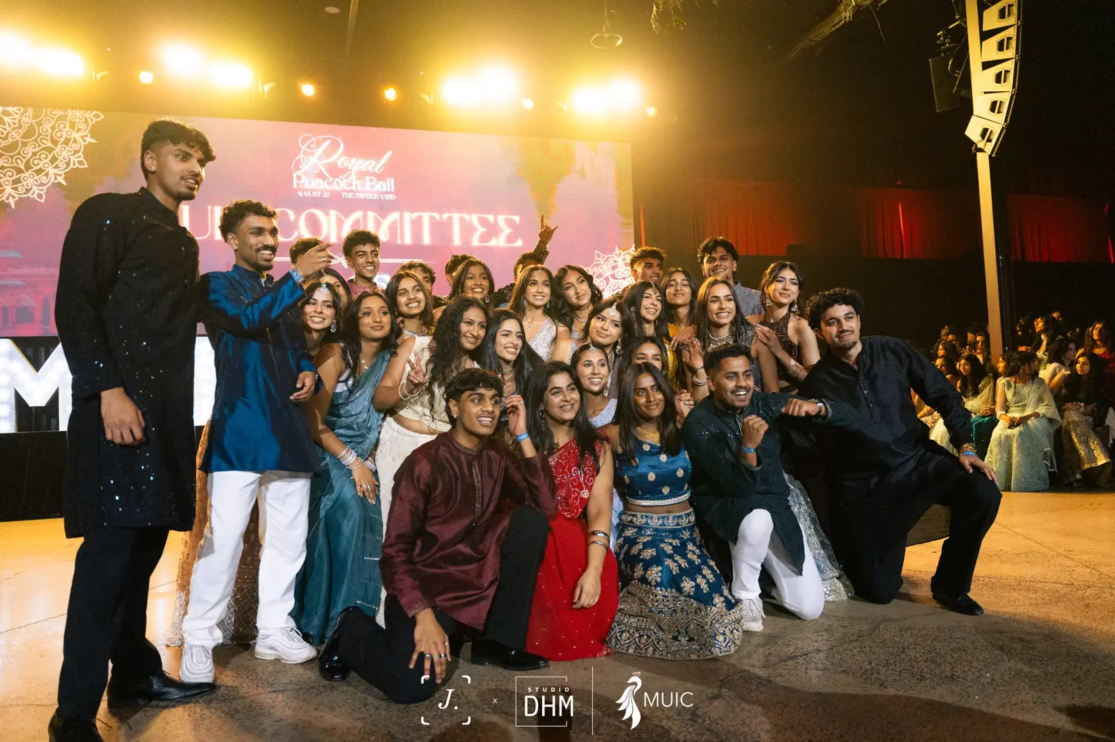 MUIC committee members on stage at an event